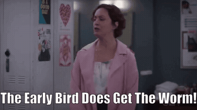 A Woman In A Pink Jacket Says " The Early Bird Does Get The Worm! " GIF