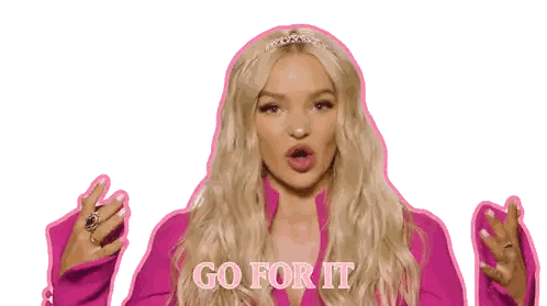 A Woman In A Pink Jacket With The Words Go For It On Her Chest Sticker