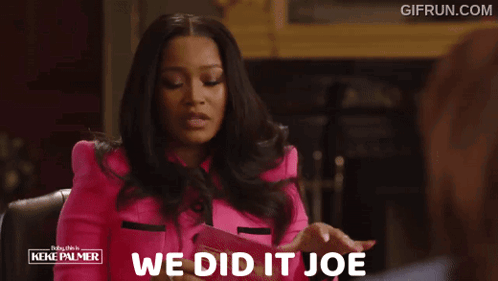 A Woman In A Pink Jacket With The Words We Did It Joe GIF