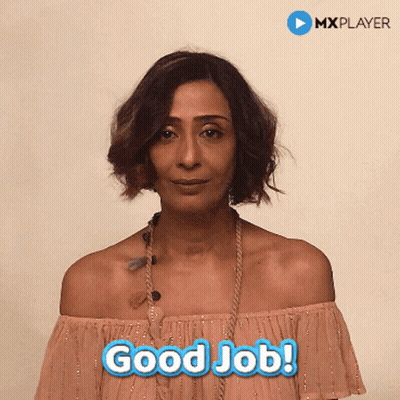 A Woman In A Pink Off The Shoulder Top Says " Good Job " GIF