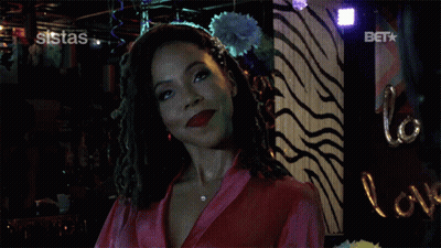 A Woman In A Pink Robe Says I Did In Front Of A Zebra Print Wall GIF