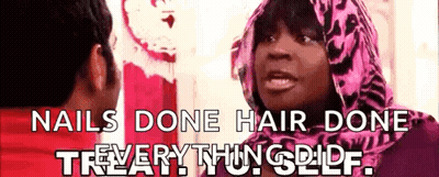 A Woman In A Pink Scarf Is Talking To A Man With The Words " Nails Done Hair Done " On The Bottom GIF