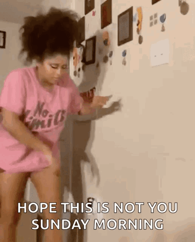 A Woman In A Pink Shirt Is Dancing In Front Of A Wall And Says Hope This Is Not You Sunday Morning GIF