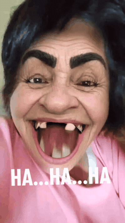 A Woman In A Pink Shirt Is Making A Funny Face With The Words Ha Ha Ha On The Bottom Right GIF