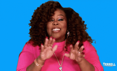 A Woman In A Pink Shirt Is Smiling In Front Of A Blue Background That Says Terrell On It GIF