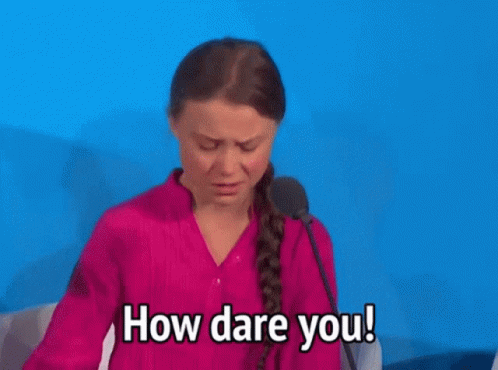 A Woman In A Pink Shirt Is Speaking Into A Microphone And Says " How Dare You " GIF