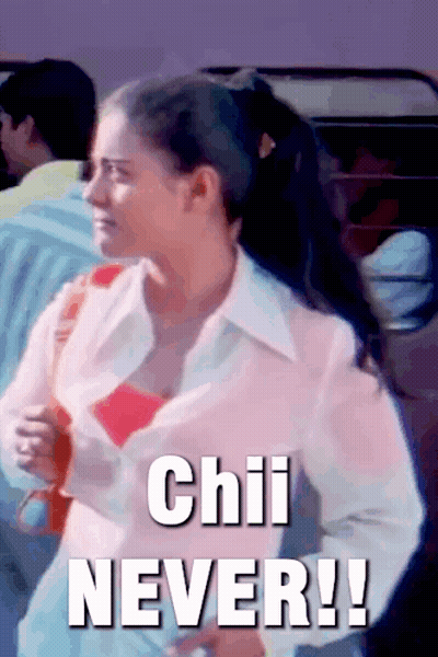 A Woman In A Pink Shirt Is Standing In Front Of A Sign That Says " Chili Never " GIF