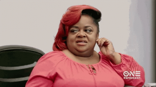 A Woman In A Pink Shirt Is Talking On A Cell Phone With One Represent Written On The Bottom GIF