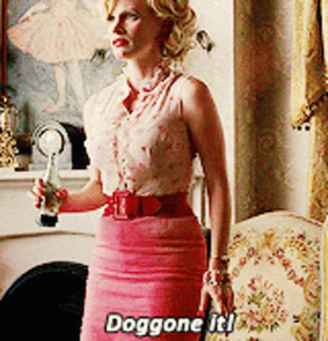 A Woman In A Pink Skirt Is Holding A Bottle And Says Doggone It ! GIF