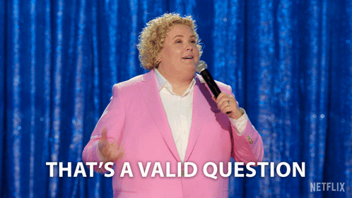 A Woman In A Pink Suit Is Holding A Microphone And Saying That 'S A Valid Question GIF