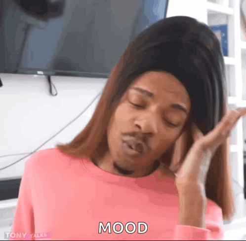 A Woman In A Pink Sweater Is Making A Funny Face And The Word Mood Is On The Screen GIF