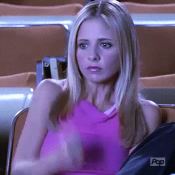 Woman In Pink Tank Sitting In Chairs GIF