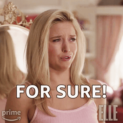 A Woman In A Pink Tank Top Says For Sure In Front Of A Mirror GIF