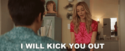 A Woman In A Pink Tie Dye Shirt Stands Next To A Man And Says I Will Kick You Out GIF