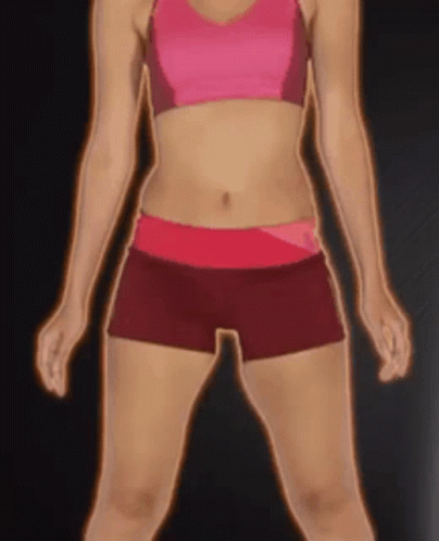 A Woman In A Pink Top And Red Shorts Stands In Front Of A Black Background GIF