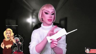 A Woman In A Pink Wig Is Holding A Piece Of Paper GIF