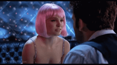 A Woman In A Pink Wig Is Kissing A Man In A Movie . GIF
