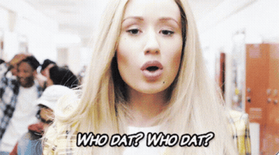 A Woman In A Plaid Jacket Is Asking Who Dat GIF