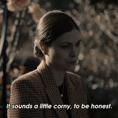 A Woman In A Plaid Jacket Is Saying It Sounds A Little Corny To Be Honest GIF