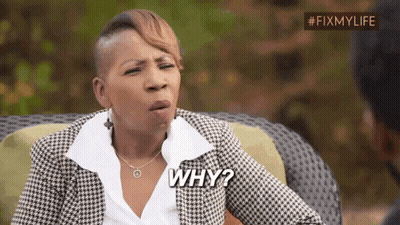 A Woman In A Plaid Jacket Is Sitting On A Couch And Asking Why . GIF