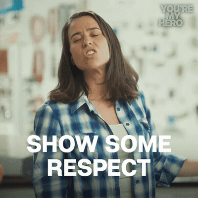 A Woman In A Plaid Shirt Is Making A Face And Says Show Some Respect GIF