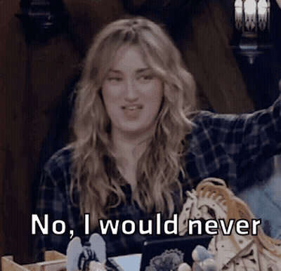 A Woman In A Plaid Shirt Says " No I Would Never " While Sitting At A Table GIF
