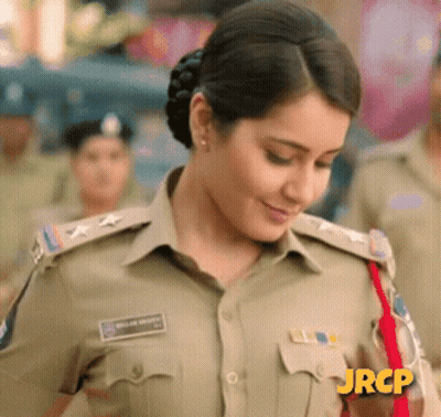 A Woman In A Police Uniform Has Jrcp Written On Her Shirt GIF
