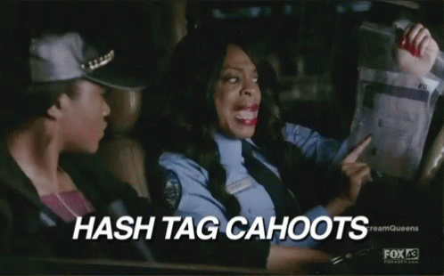 A Woman In A Police Uniform Is Driving A Car While Another Woman Looks Out The Window . GIF