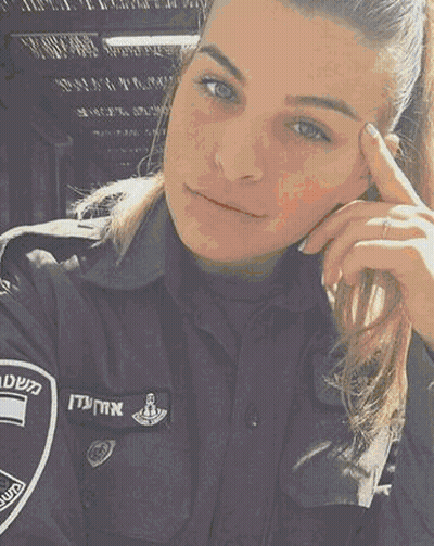 A Woman In A Police Uniform Is Looking At The Camera With Her Hand On Her Forehead . GIF