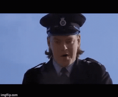 A Woman In A Police Uniform Is Standing In Front Of A Blue Sky And Says Well Well Well . GIF