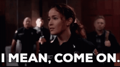 A Woman In A Police Uniform Is Standing In Front Of A Crowd Of People And Says `` I Mean , Come On . '' GIF