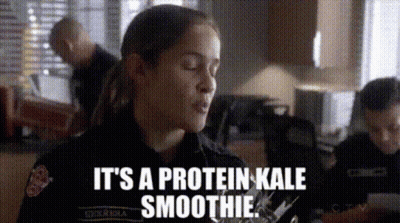 A Woman In A Police Uniform Is Talking About A Smoothie . GIF