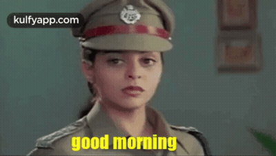A Woman In A Police Uniform Is Wearing A Hat And Saying Good Morning . GIF