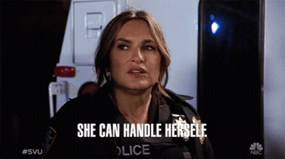 A Woman In A Police Uniform Says She Can Handle Herself In Front Of An Ambulance GIF