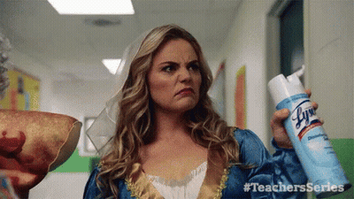 A Woman In A Princess Costume Is Holding A Lysol Spray . GIF