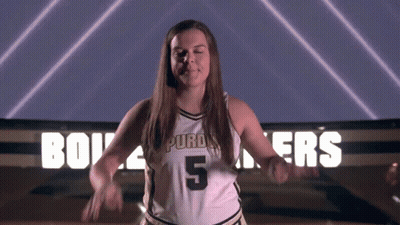 A Woman In A Purdue Jersey Number 5 GIF
