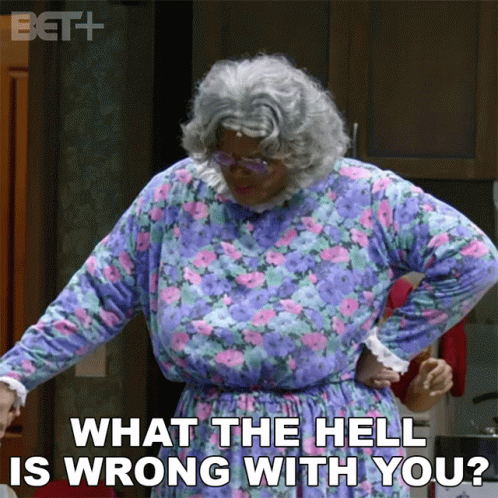 A Woman In A Purple And Pink Floral Dress Says What The Hell Is Wrong With You GIF