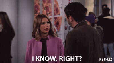 A Woman In A Purple Coat Is Talking To A Man And Says " I Know Right " GIF