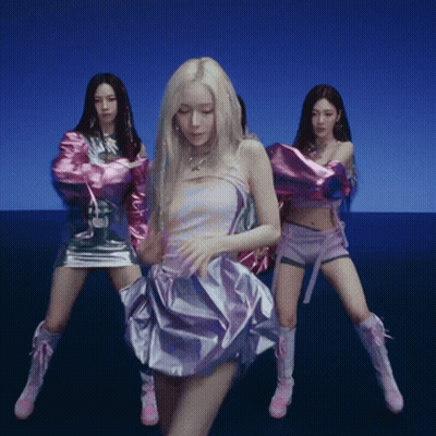 A Woman In A Purple Dress Is Dancing With Two Other Girls GIF