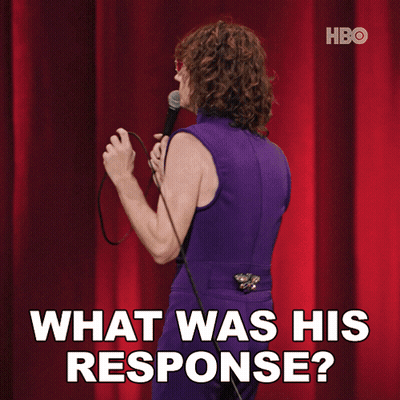A Woman In A Purple Dress Is Holding A Microphone And Saying What Was His Response GIF