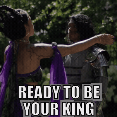 A Woman In A Purple Dress Is Hugging A Man In Armor With The Words " Ready To Be Your King " Above Them GIF