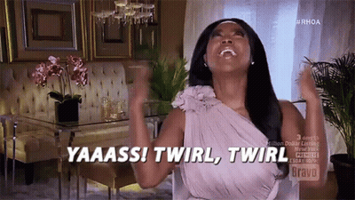 A Woman In A Purple Dress Is Saying Yaaass ! Twirl , Twirl GIF