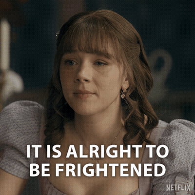 A Woman In A Purple Dress With The Words It Is Alright To Be Frightened GIF