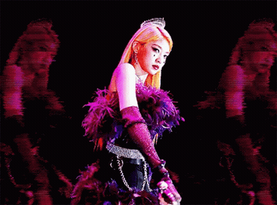 A Woman In A Purple Feathered Dress Is Holding A Sword In Her Hand . GIF