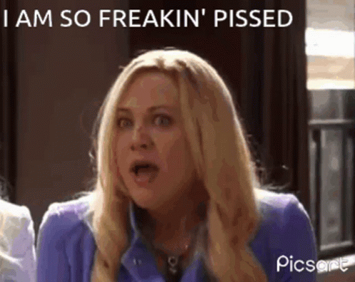 A Woman In A Purple Jacket Is Making A Funny Face And Says I Am So Freakin ' Pissed GIF