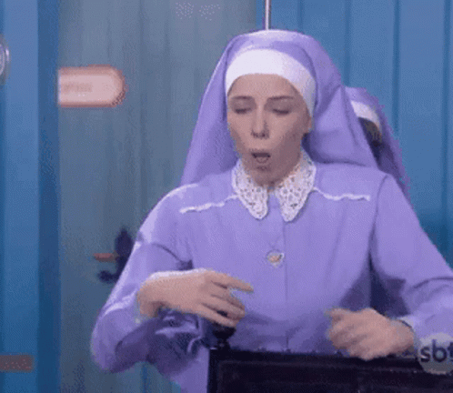 A Woman In A Purple Nun Costume Is Holding A Briefcase GIF
