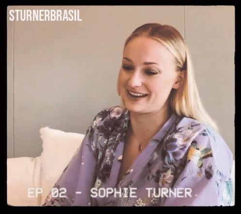 A Woman In A Purple Robe Is Smiling And Ep 02 - Sophie Turner GIF