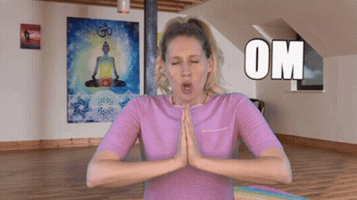 A Woman In A Purple Shirt Is Meditating With The Word Om Above Her GIF