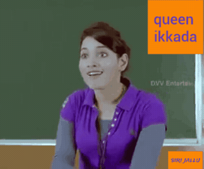 A Woman In A Purple Shirt Is Sitting In Front Of A Green Board With The Words Queen Ikkada On It . GIF