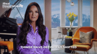A Woman In A Purple Shirt Says Things Have Definitely Shifted In Front Of A Piano GIF